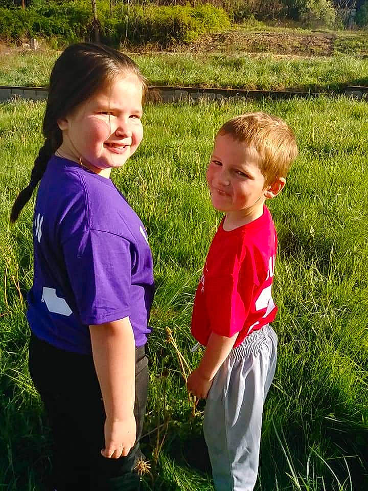 Brantley is registered to the contest to win money with this photo: arm, child, eye, flower, fun, grass, grass_family, happy, joy, meadow, people, person, photography, plant, play, shoulder, sibling, smile, spring, summer