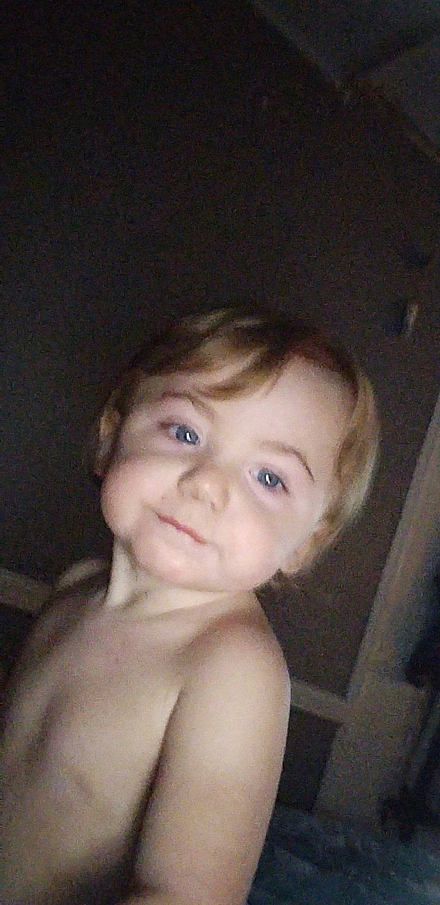 Noah is registered to the contest to win money with this photo: baby, black_hair, cheek, chest, child, ear, eyelash, flash_photography, forehead, fun, human_body, iris, jaw, lip, neck, no_expression, nose, person, smile, toddler