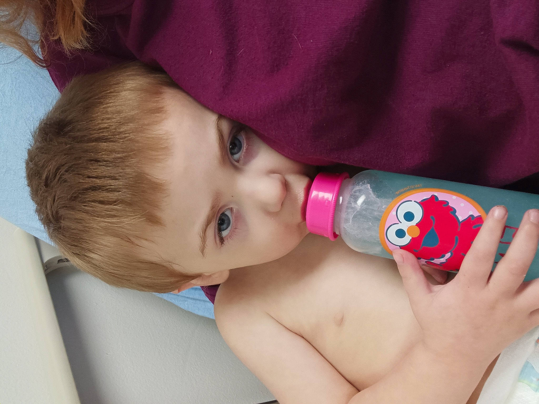 Noah is registered to the contest to win money with this photo: baby, baby_products, bottle, chest, child, drink, drinking, drinkware, elbow, eyelash, finger, hand, lip, nail, person, plastic_bottle, skin, toddler, water, water_bottle