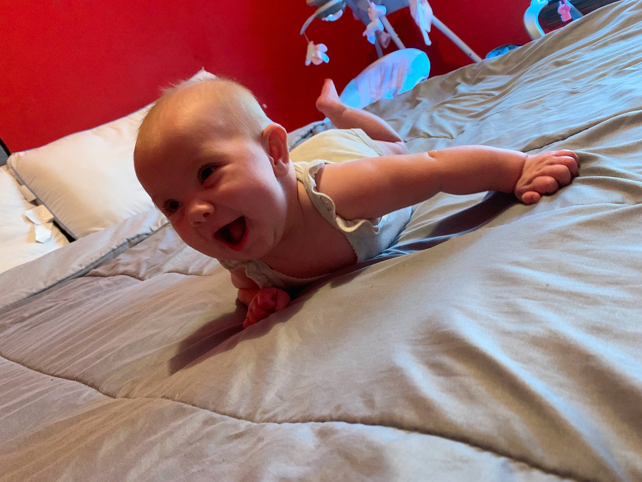 Amirah is registered to the contest to win money with this photo: abdomen, arm, baby, baby_toddler_clothing, bed, child, comfort, event, finger, flooring, fun, happy, human_leg, linens, person, sitting, skin, smile, textile, toddler