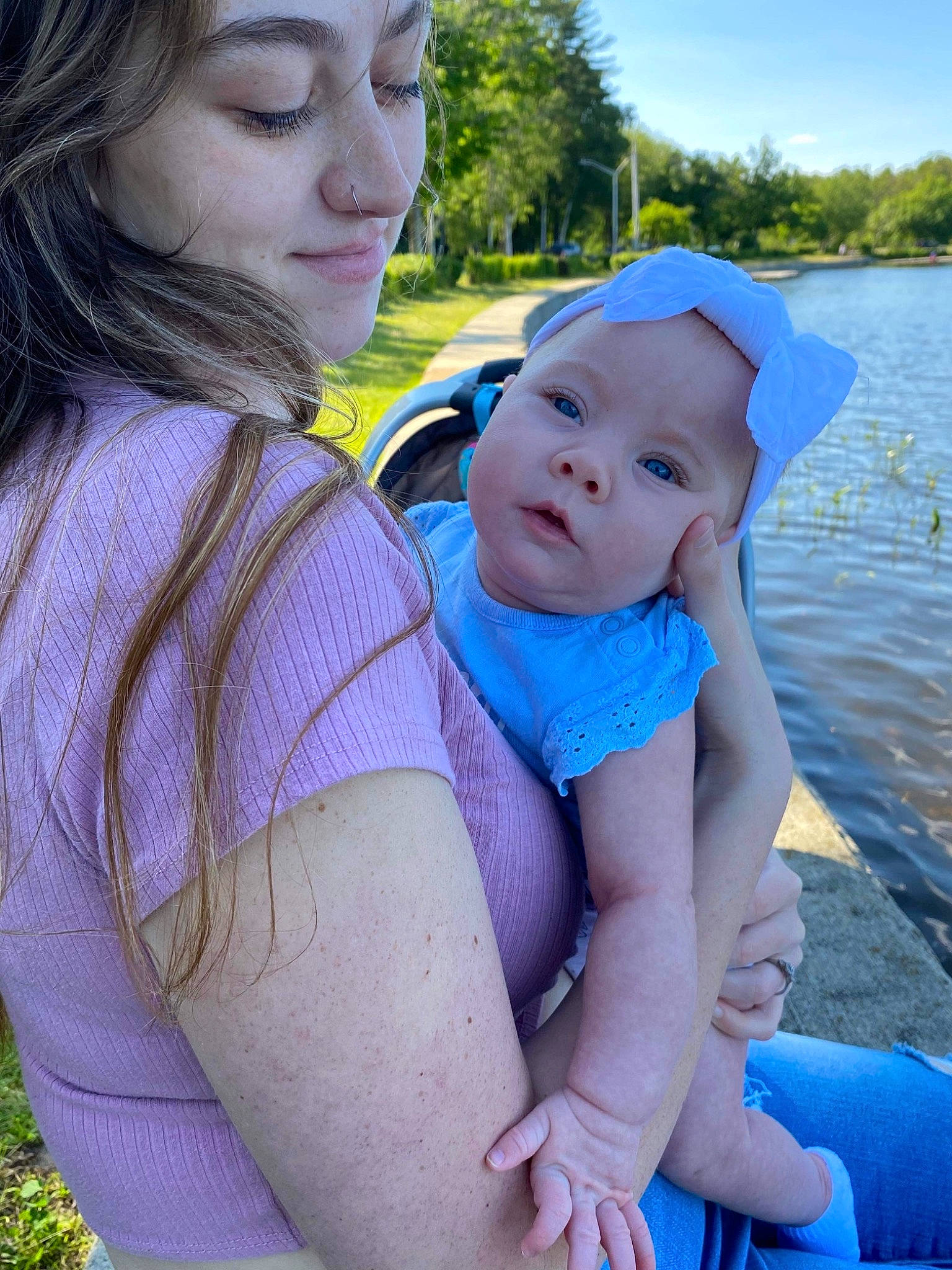 Amirah joined the competition — help win amazing prizes! baby, baby_toddler_clothing, blue, electric_blue, face, fun, grass, happy, hat, headwear, lake, leisure, people_in_nature, person, plant, product, recreation, skin, sky, toddler