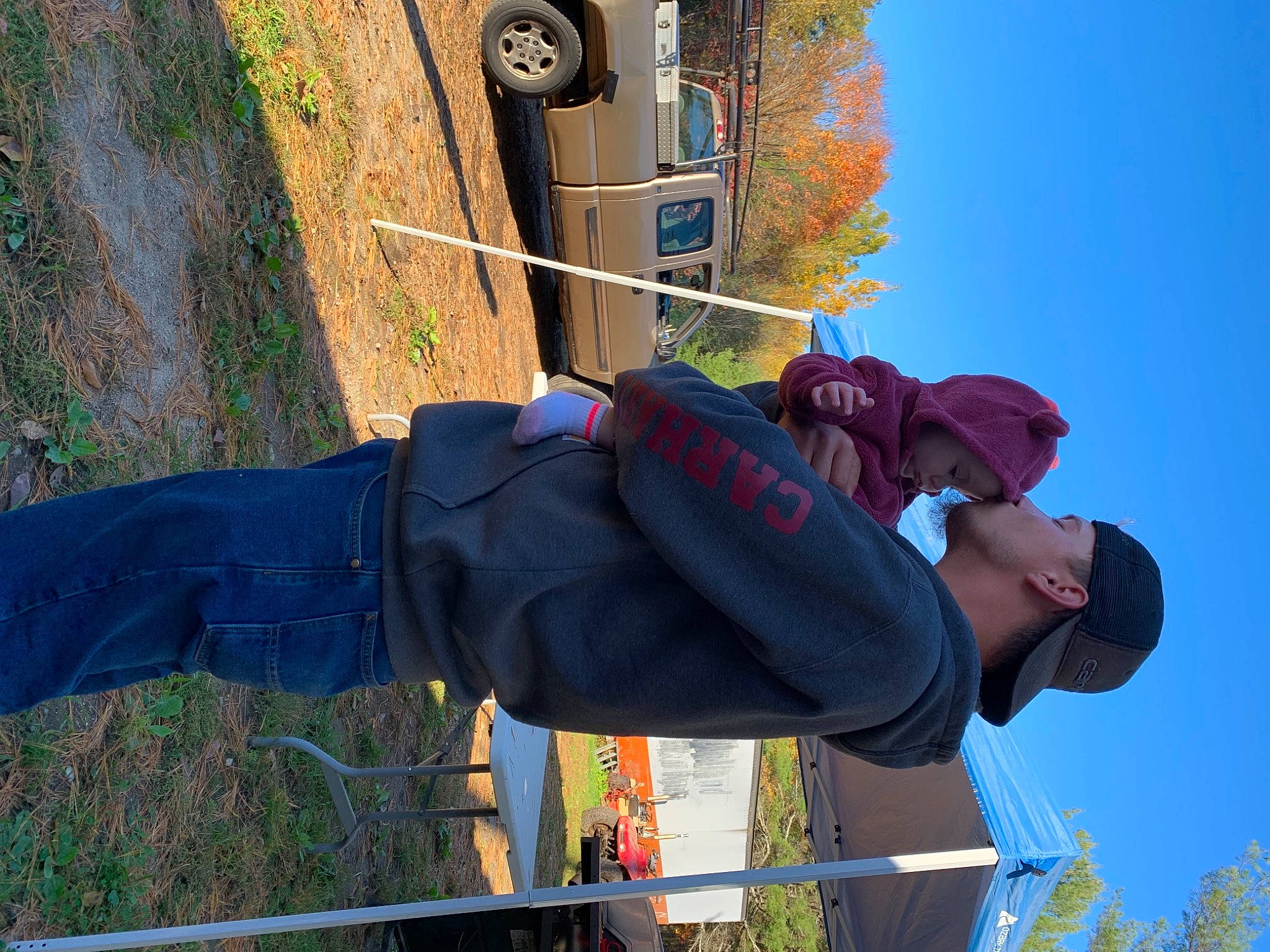 Amirah is registered to the contest to win money with this photo: adventure, automotive_tire, electric_blue, fun, hat, headwear, leisure, person, plant, recreation, sky, tire, travel, tree, wheel