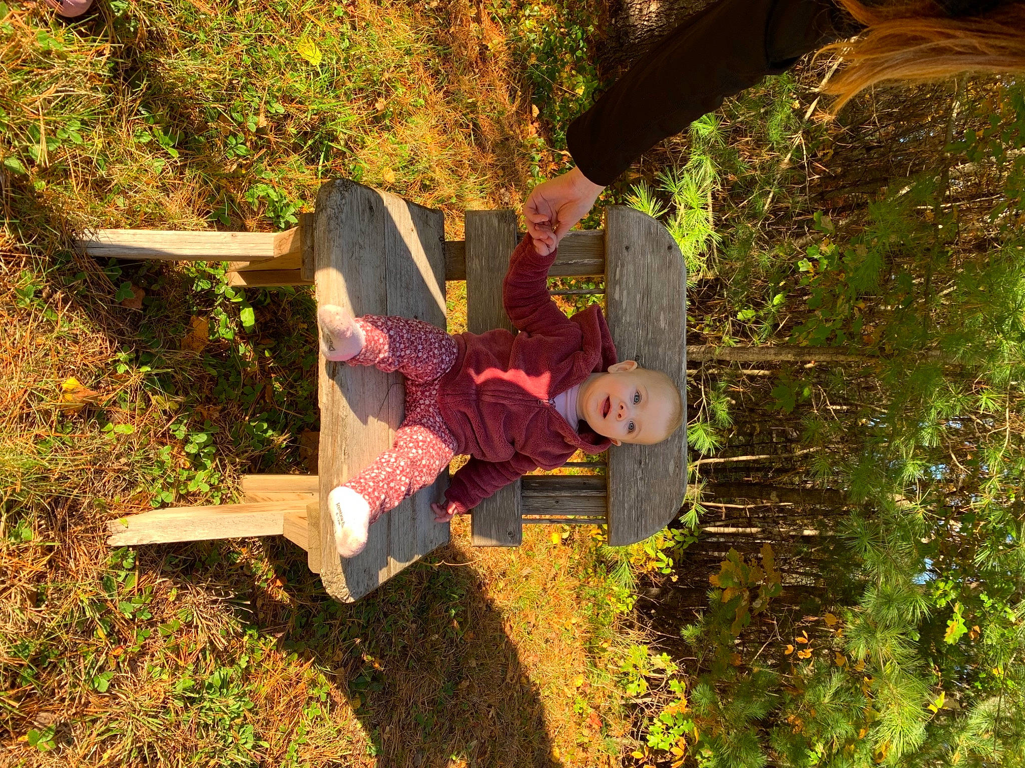 Amirah is registered to the contest to win money with this photo: fun, garden, grass, happy, landscape, leisure, outdoor_furniture, people_in_nature, person, plant, shade, shadow, shrub, sitting, soil, t_shirt, tints_and_shades, tree, wood, woody_plant