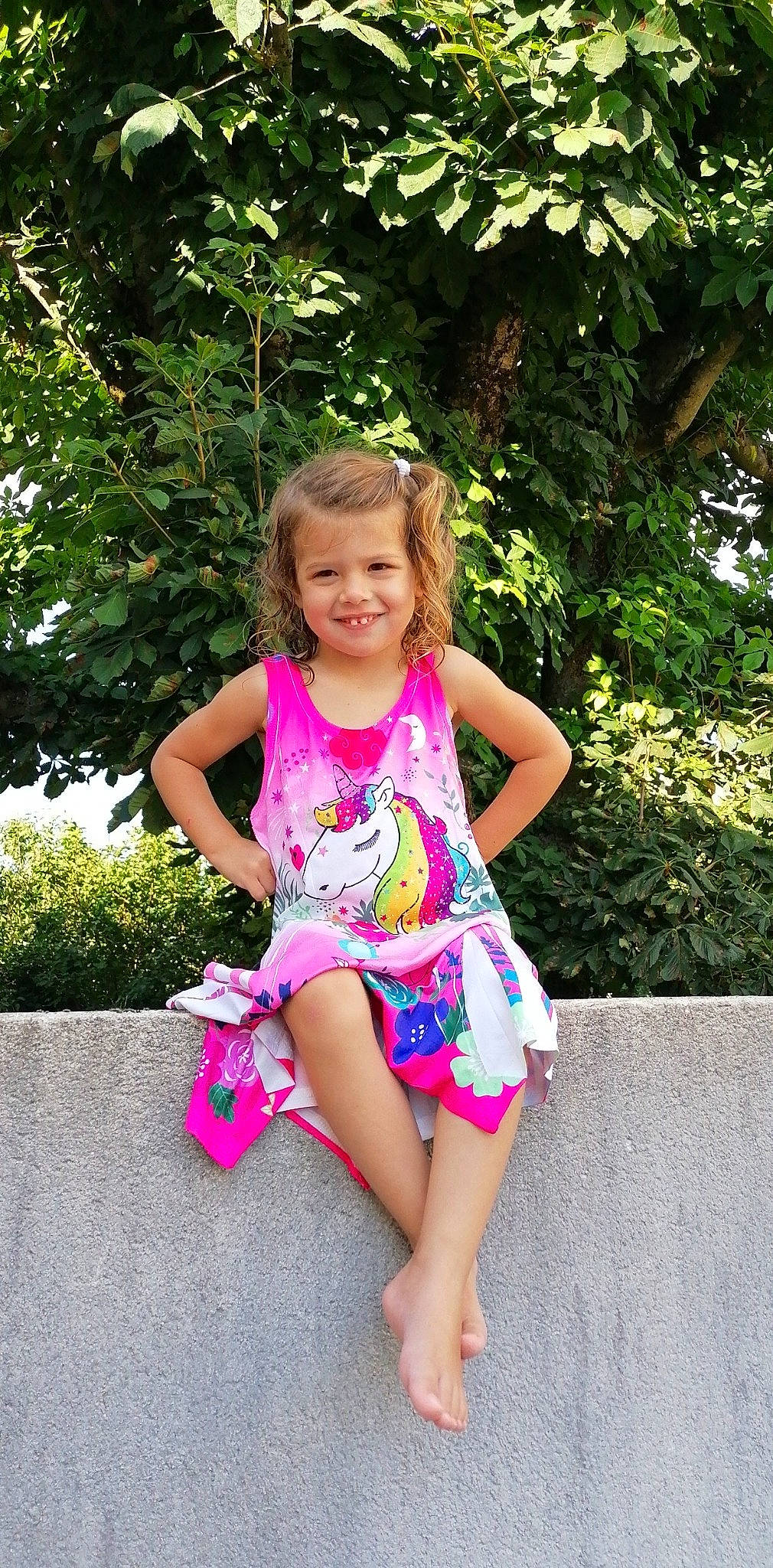 Calie participe au concours pour gagner de l'argent avec cette photo : baby_toddler_clothing, botany, clothing, dress, eye, fun, grass, hair, happy, head, human_body, joy, leisure, people_in_nature, person, pink, plant, shoulder, smile, summer