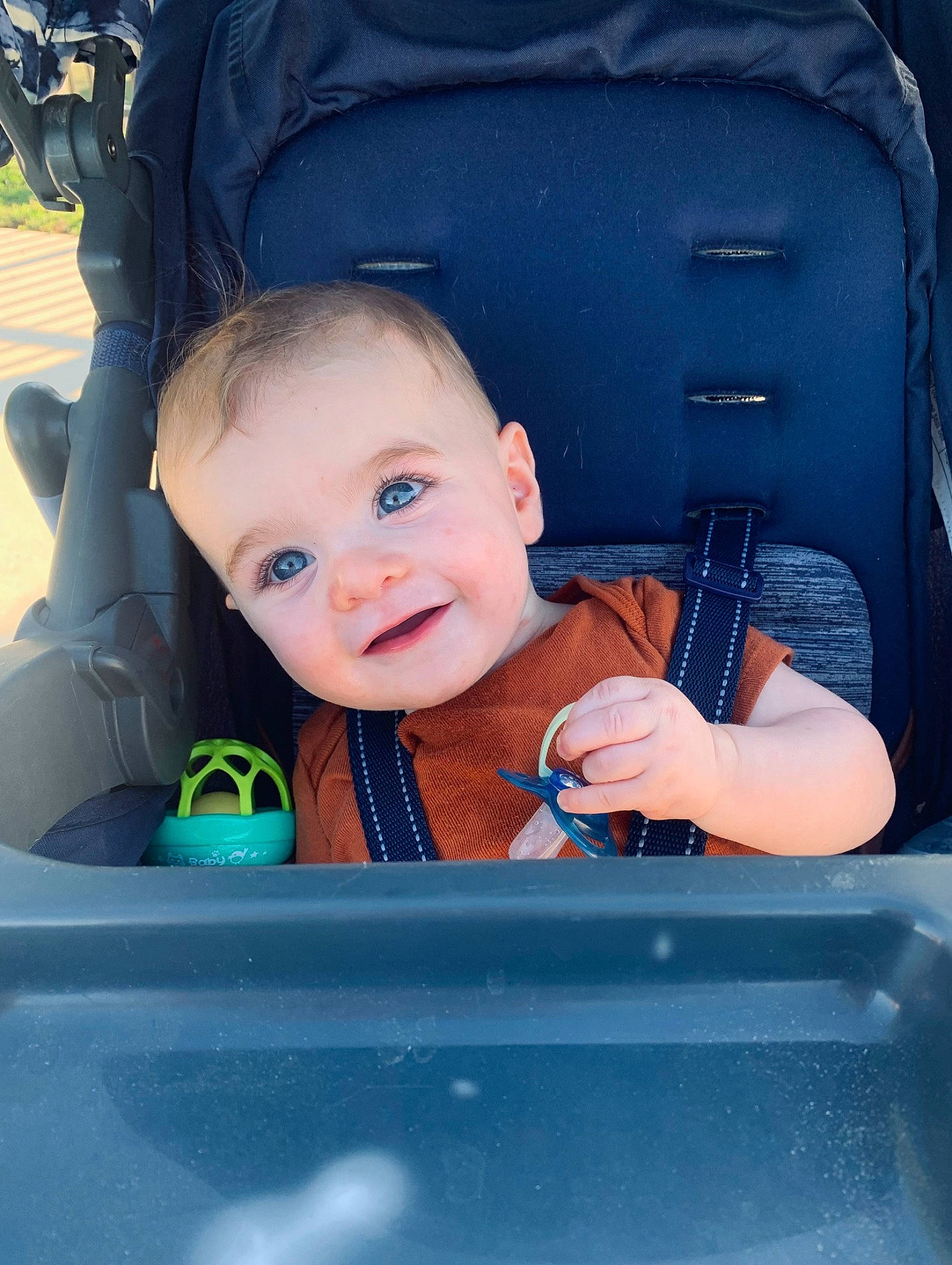 Noah is registered to the contest to win money with this photo: auto_part, automotive_design, baby, baby_carriage, baby_products, baby_safety, baby_toddler_clothing, blue, car_seat, child, comfort, electric_blue, family_car, happy, joy, motor_vehicle, person, seat_belt, sitting, smile