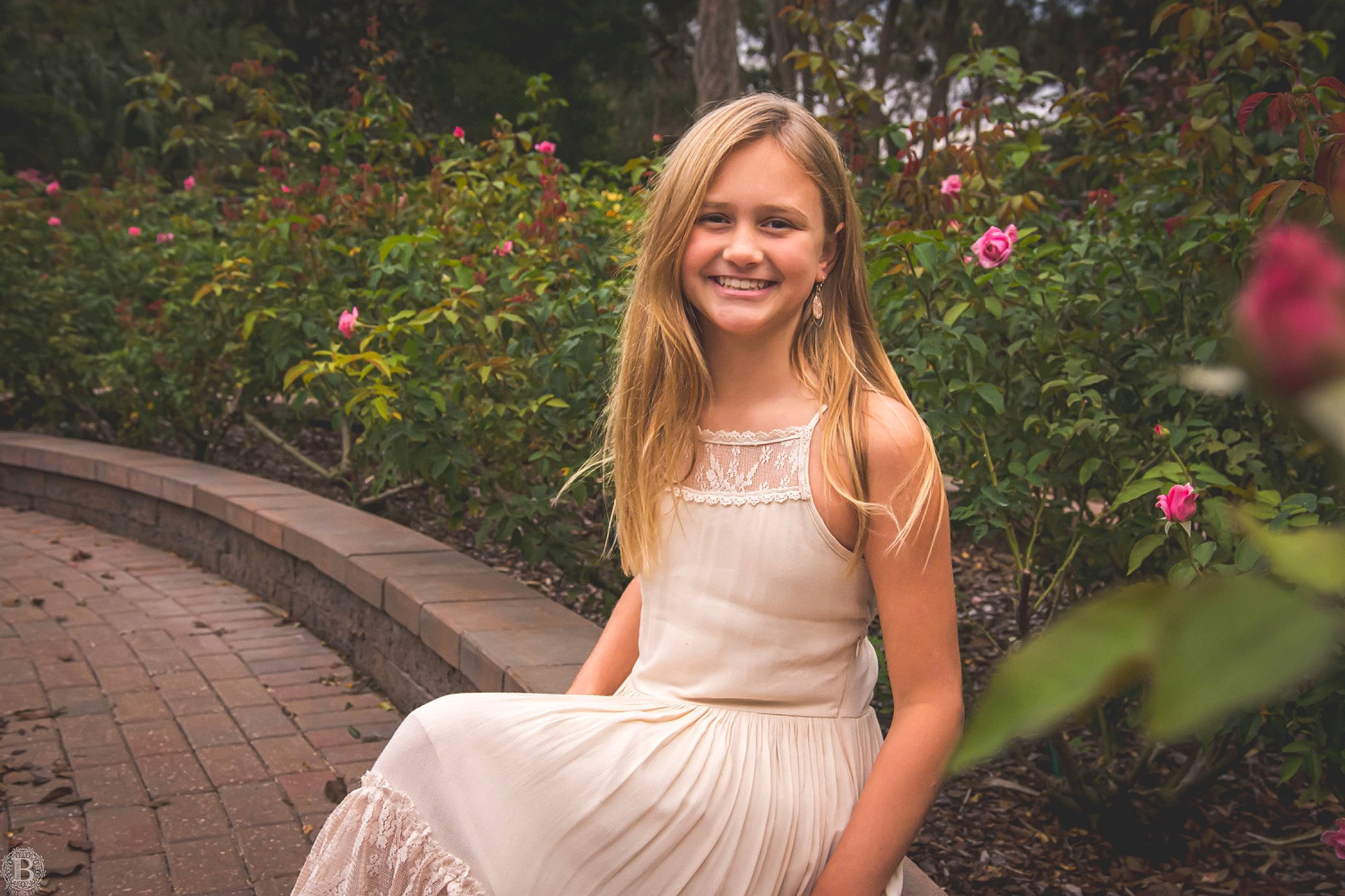 Gabriella is registered to the contest to win money with this photo: botany, dress, eye, fawn, flash_photography, flower, grass, hair, happy, human_body, joy, leaf, nature, people_in_nature, person, petal, pink, plant, shoulder, smile
