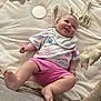 baby, bunny_ears, child, clothing, cute, foot, giraffe_toy, hand, happy_expression, indoor, infant, mirror, nike_shirt, person, pink_shorts, play_mat, playtime, plush_toys, smiling, soft_texture