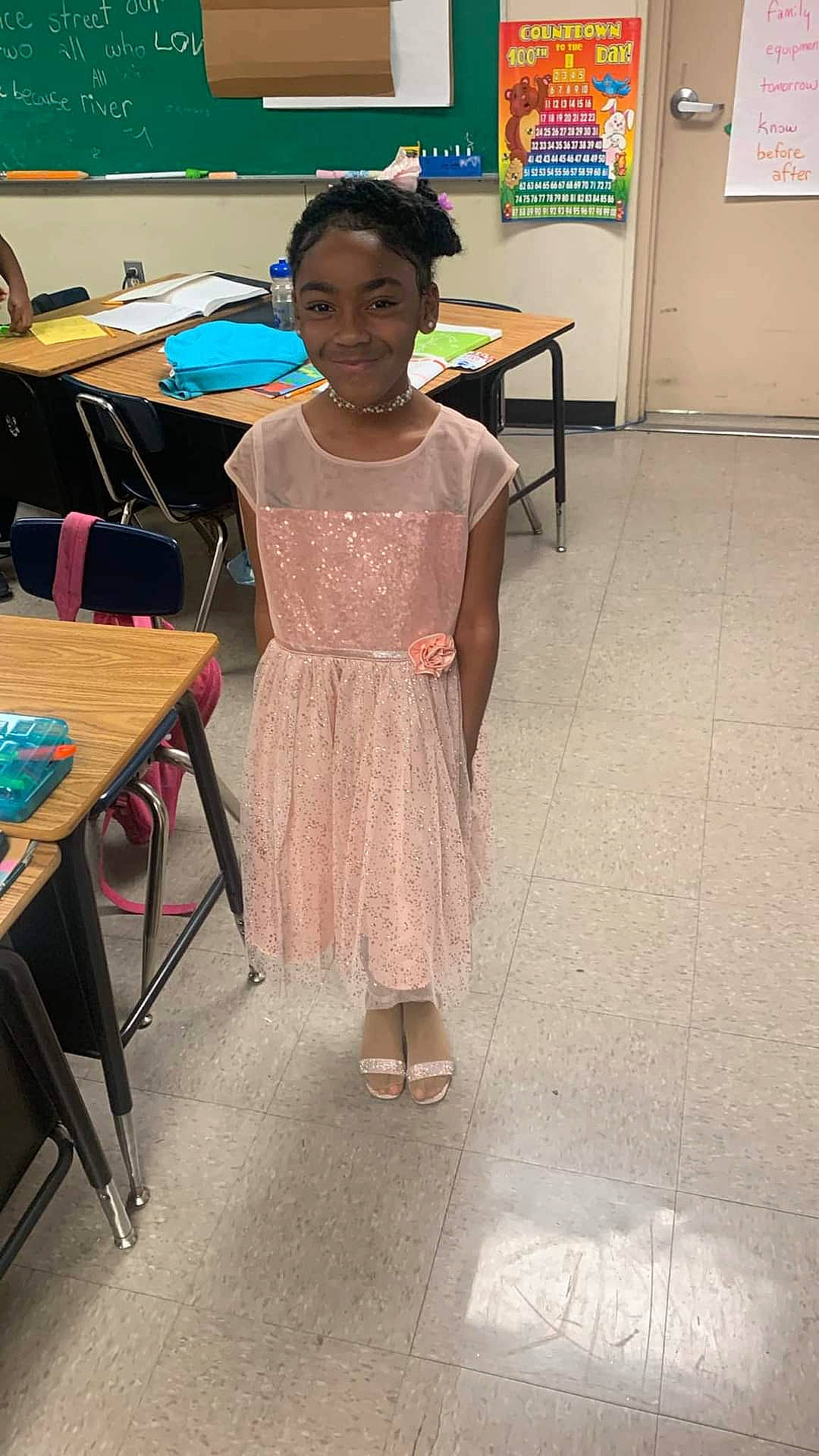 Kinsley joined the competition — help win amazing prizes! chair, child, class, desk, dress, education, event, fashion_design, flooring, fun, furniture, joy, leisure, person, room, school, sitting, table, toddler, tradition