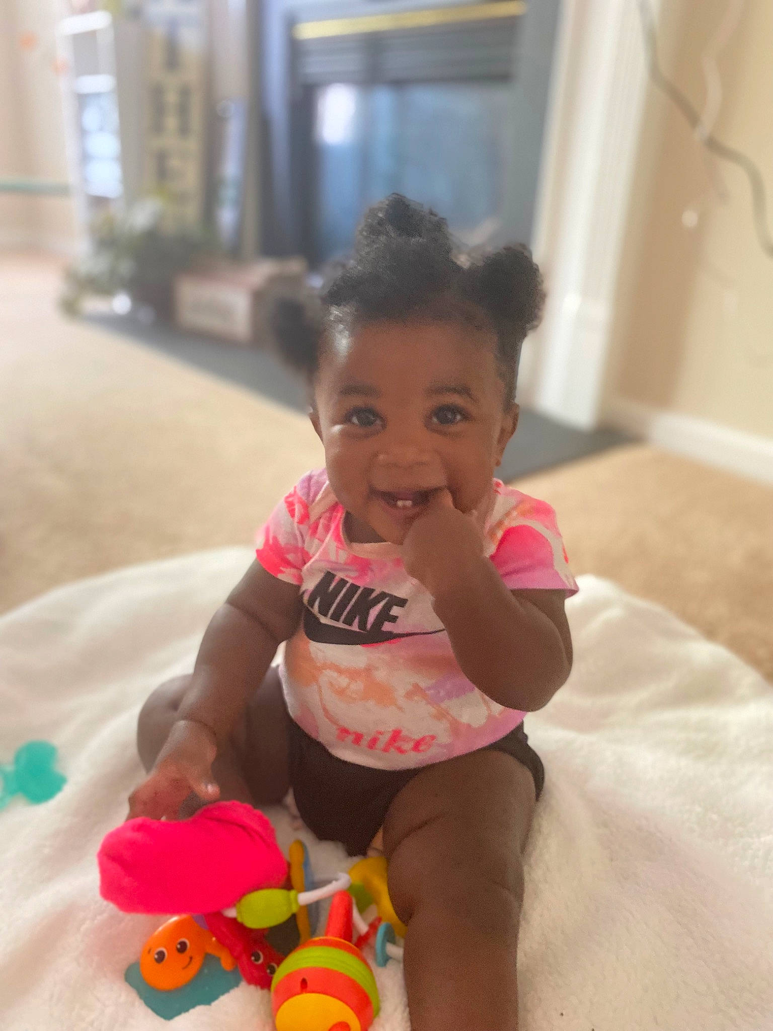 Iyana joined the competition — help win amazing prizes! baby, baby_playing_with_toys, baby_toddler_clothing, child, door, event, flooring, fun, happy, leisure, person, play, room, shorts, sitting, skin, smile, thigh, toddler, toy