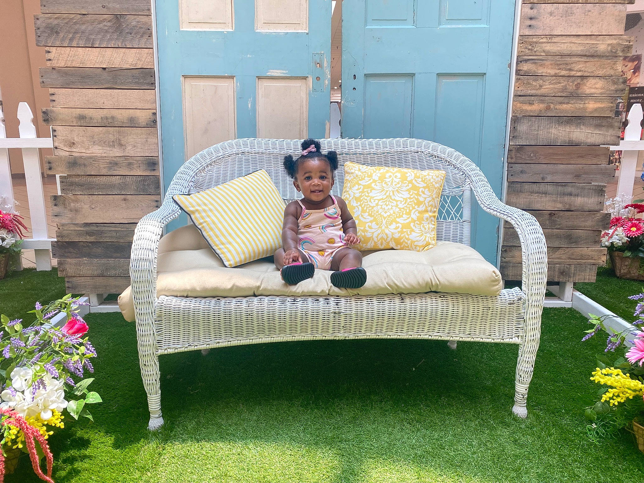 Iyana is registered to the contest to win money with this photo: armrest, chair, comfort, door, flower, flowerpot, furniture, grass, grass_family, lawn, leisure, outdoor_bench, outdoor_furniture, outdoor_sofa, outdoor_table, person, plant, rectangle, shrub, sitting