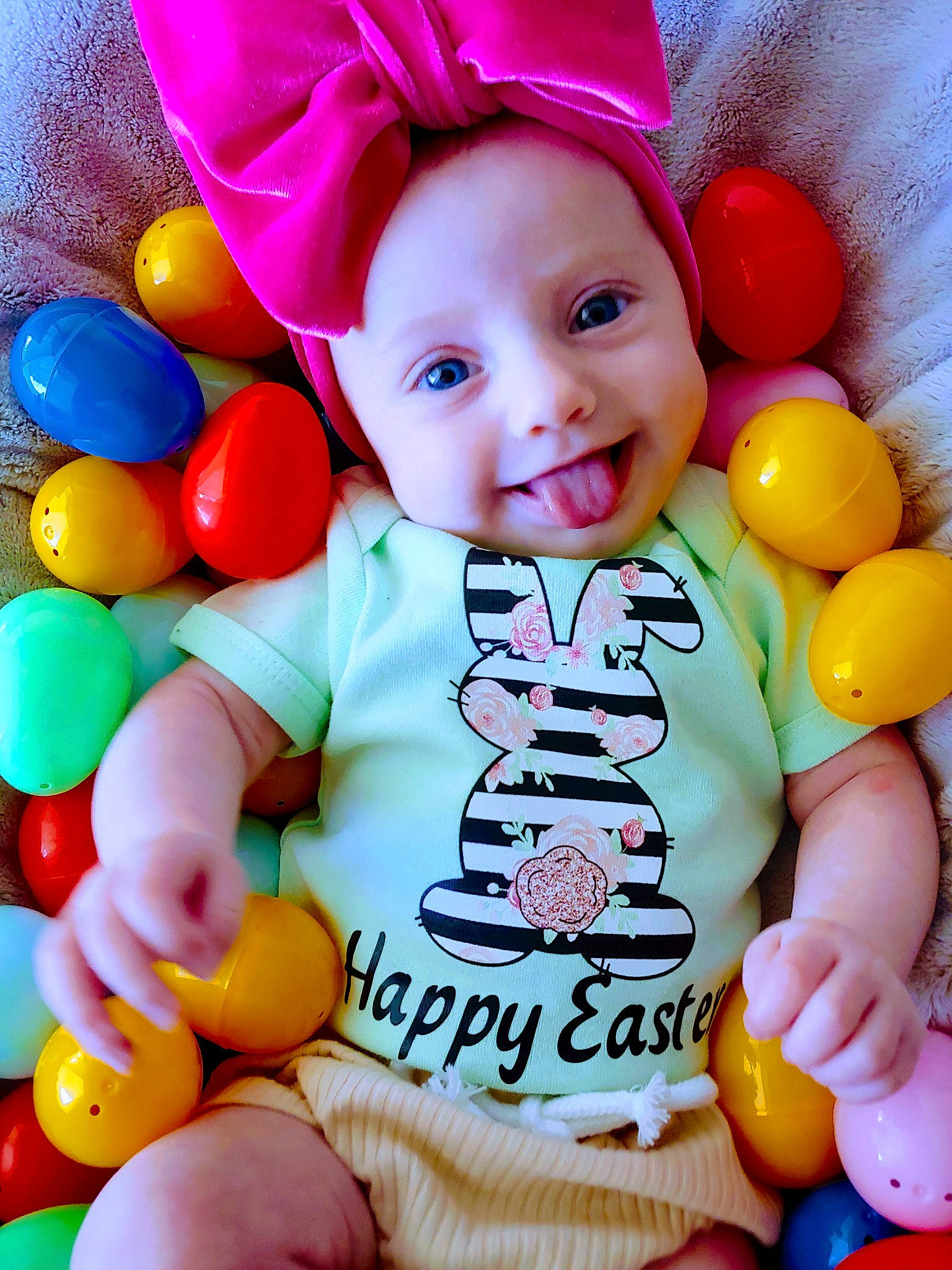 Delta joined the competition — help win amazing prizes! baby, baby_playing_with_toys, baby_products, baby_toddler_clothing, child, face, facial_expression, font, fun, happy, orange, organ, party_supply, person, pink, product, smile, toddler, toy, white