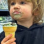 Kash is registered to the contest to win money with this photo: child, ice_cream, cone, messy_face, blonde_hair, blue_eyes, hand, hoodie, food, sweet, snack, indoor, portrait, closeup, candid, toddler, delicious, happy, face, person