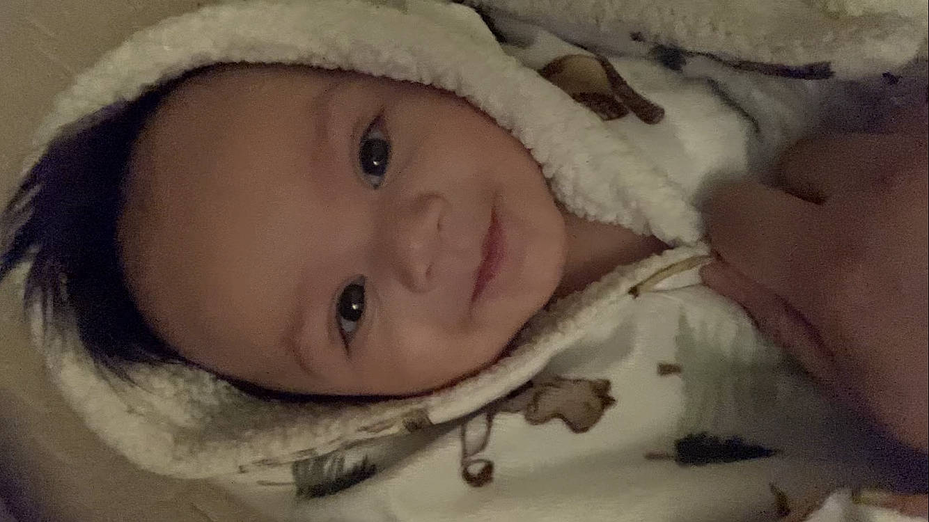 Liam is registered to the contest to win money with this photo: cheek, chin, ear, eye, eyebrow, eyelash, face, happy, head, headgear, human_body, iris, lip, mouth, nose, outerwear, person, skin, smile, textile