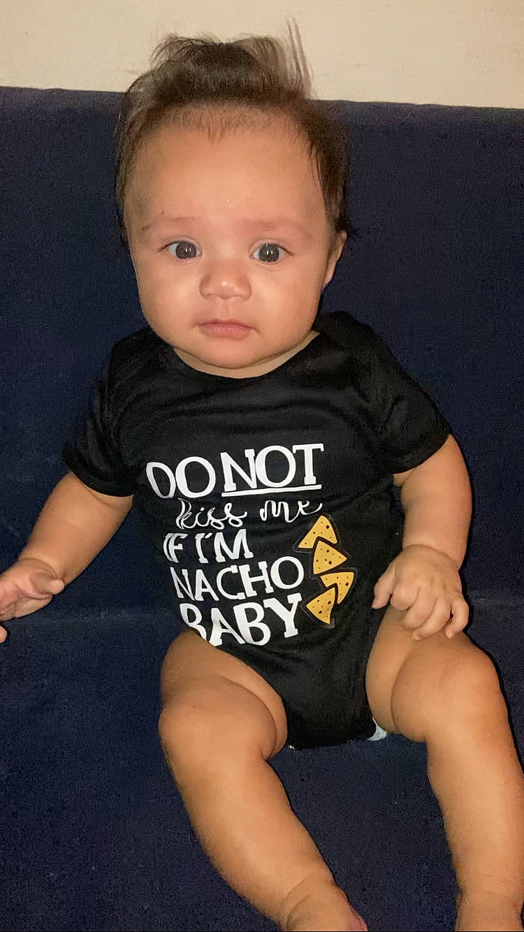 Liam joined the competition — help win amazing prizes! arm, baby_toddler_clothing, cheek, eye, face, finger, human_body, human_leg, iris, joint, knee, leg, neck, person, shoulder, skin, sleeve, standing, t_shirt, thigh