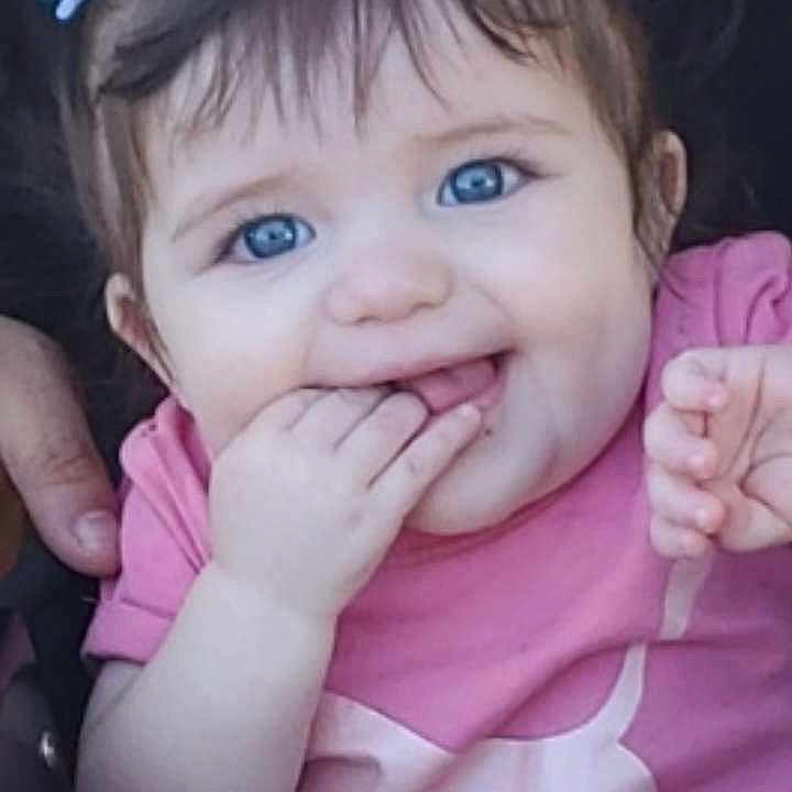 Blaekleigh is registered to the contest to win money with this photo: accessories, baby, bodypart, clothing, earring, face, finger, hand, happy, head, jewelry, laughing, mouth, person, photography, portrait, purple, smile, t_shirt, teeth