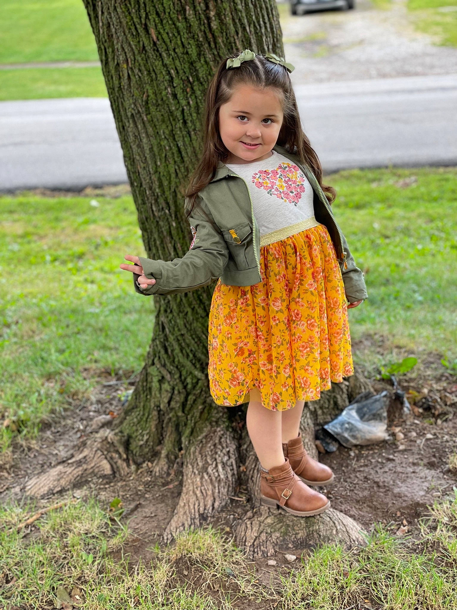 Gianna joined the competition — help win amazing prizes! botany, branch, dress, eye, face, footwear, green, hair, head, joy, leaf, leg, outerwear, people_in_nature, person, plant, shoe, smile, sneakers, street_fashion