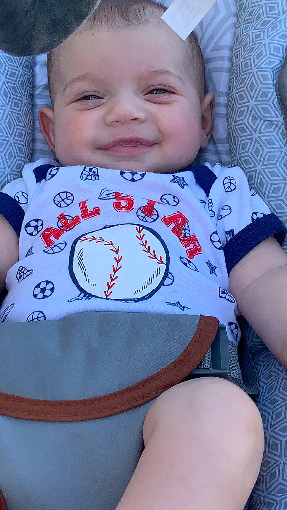 Brenden is registered to the contest to win money with this photo: baby, baby_toddler_clothing, cheek, collar, eye, facial_expression, finger, happy, iris, joy, lip, neck, organ, person, pink, skin, sleeve, smile, textile, thigh