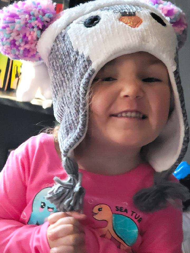 Kenlee is registered to the contest to win money with this photo: baby_toddler_clothing, beanie, bonnet, cheek, cool, facial_expression, headgear, headwear, iris, joy, knit_cap, magenta, organ, person, pink, purple, stuffed_toy, textile, toddler, toy