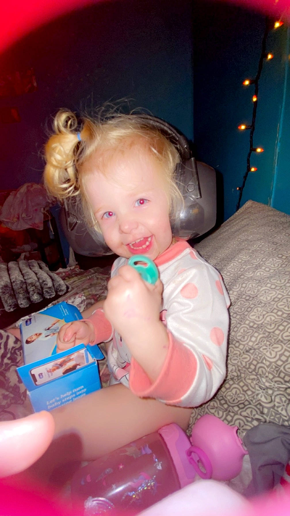 Braelynn is registered to the contest to win money with this photo: baby, baby_toddler_clothing, cheek, child, event, face, facial_expression, flash_photography, fun, happy, human_leg, iris, lap, mouth, person, pink, sitting, skin, smile, thigh