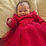 Milya participe au concours pour gagner de l'argent avec cette photo : baby, child, red_dress, heart_pattern, smiling, cushion, sofa, indoor, cute, happy, toddler, white_tights, red_socks, portrait, infant, cozy, plush, soft_texture, adorable, fashion