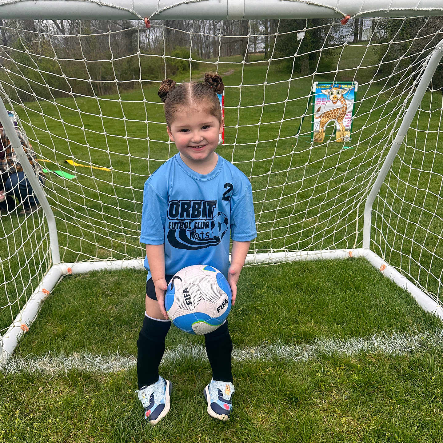 Brinley joined the competition — help win amazing prizes! adult, ball, boy, child, clothing, face, football, grass, head, male, person, photography, plant, portrait, shorts, soccer, soccerball, sphere, sport, t_shirt
