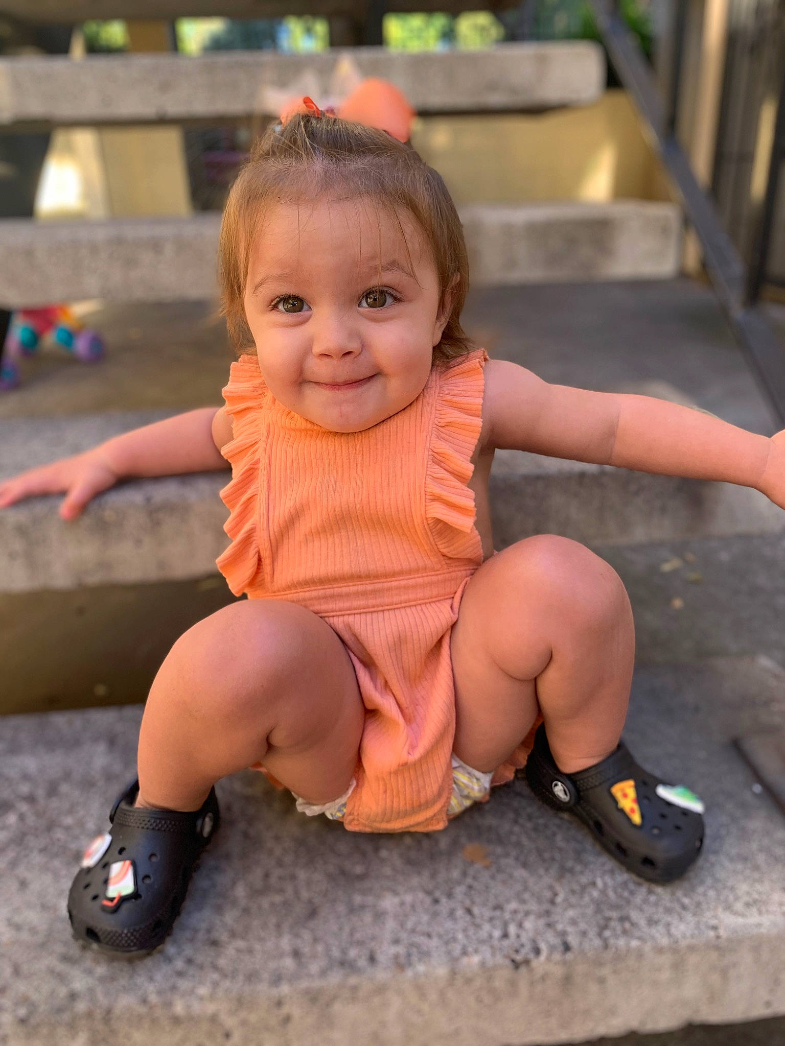 Amara is registered to the contest to win money with this photo: facial_expression, finger, fun, hairstyle, happy, head, joint, joy, knee, leg, leisure, mouth, person, pink, public_space, recreation, sandal, skin, smile, standing