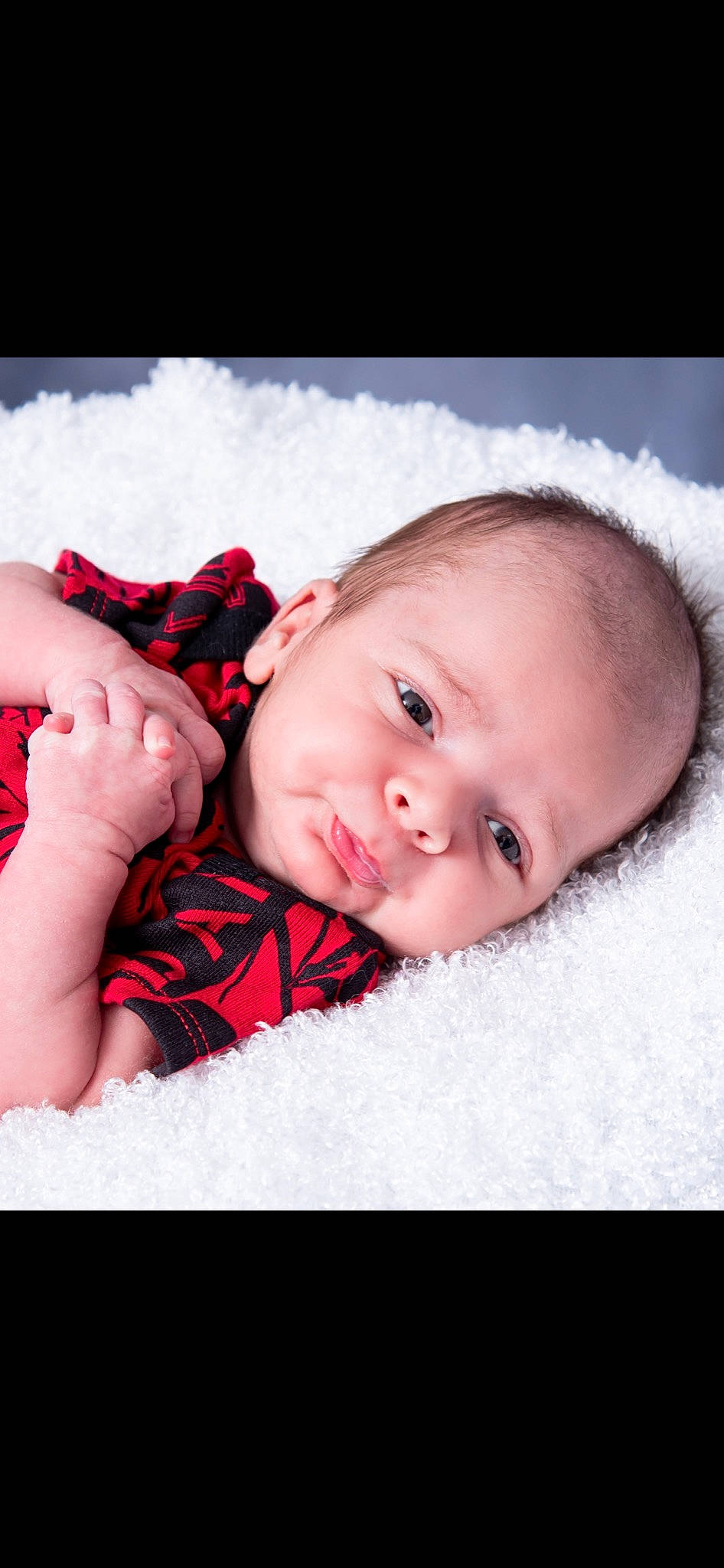 Demarcus is registered to the contest to win money with this photo: baby, baby_toddler_clothing, cheek, child, comfort, eye, face, facial_expression, flash_photography, happy, iris, linens, lip, nose, pattern, person, skin, sleeve, smile, textile