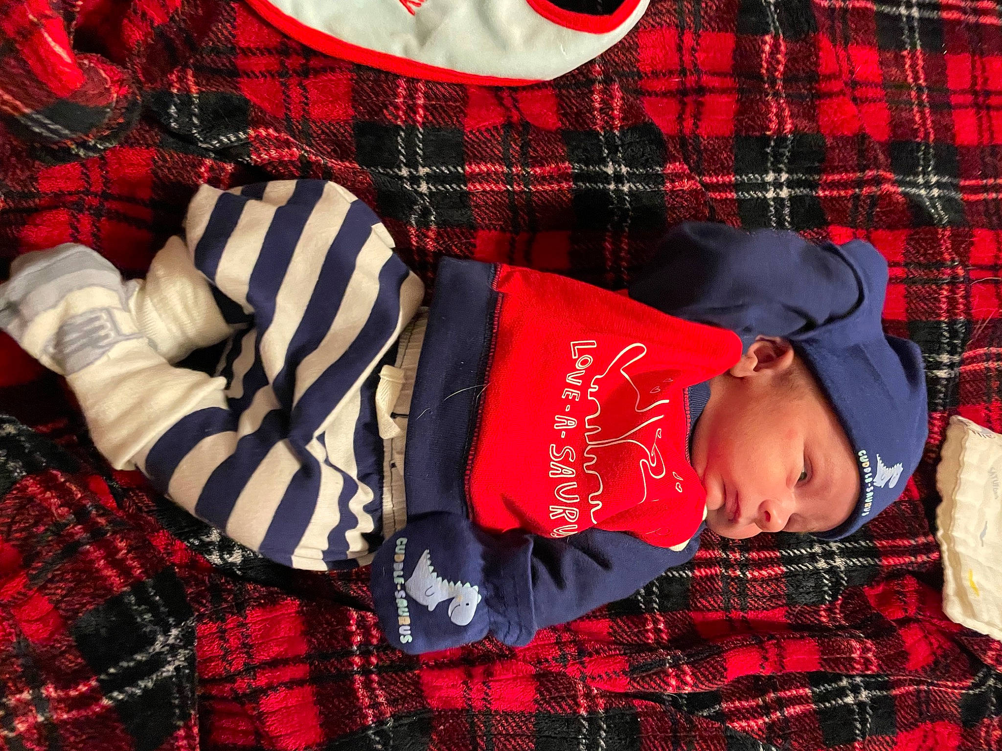 Demarcus joined the competition — help win amazing prizes! baby, baby_toddler_clothing, black, carmine, collar, comfort, design, electric_blue, hat, headwear, light, linens, pattern, person, plaid, red, sleeve, t_shirt, tartan, textile