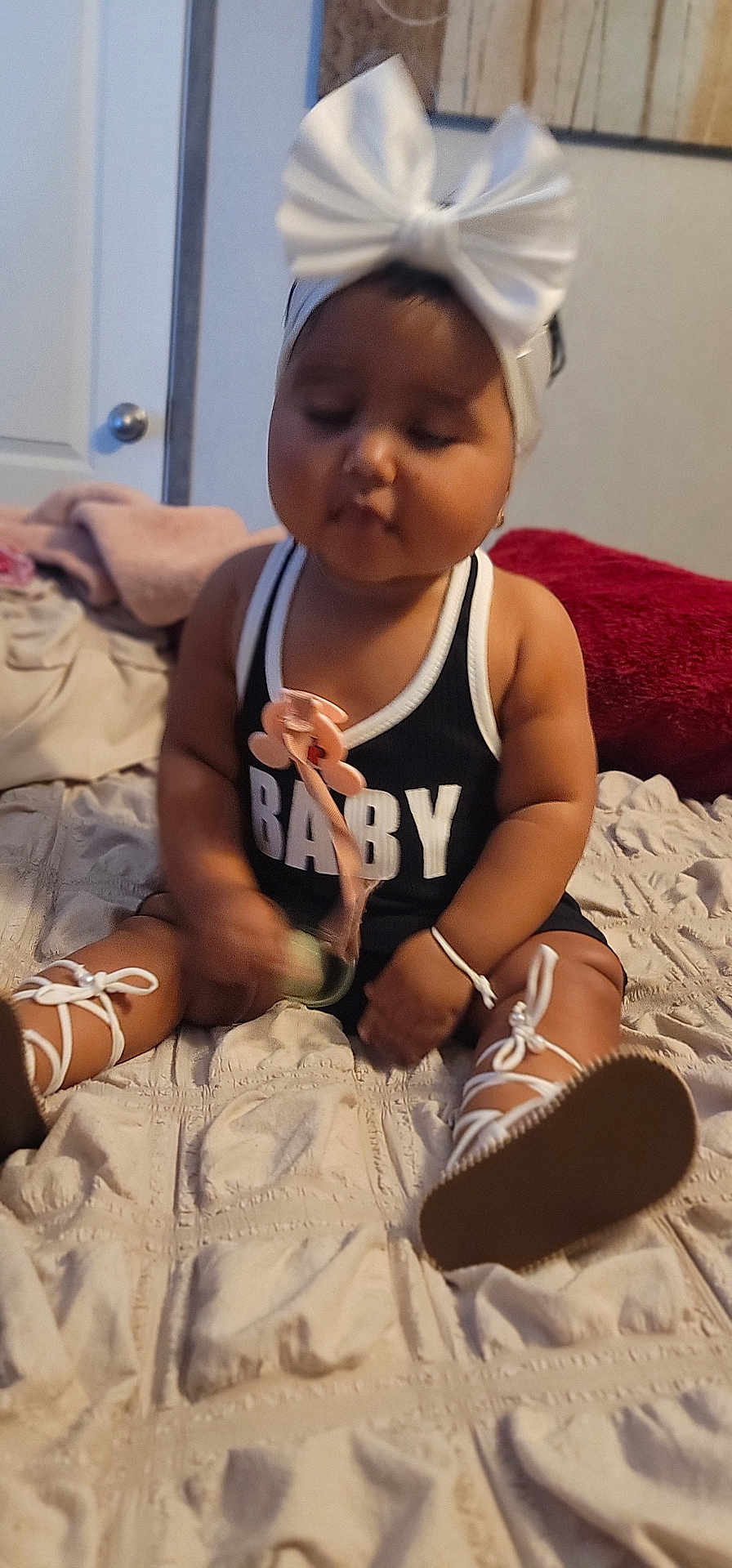 Jaseirys is registered to the contest to win money with this photo: baby, bed, bodypart, clothing, couch, face, finger, footwear, furniture, hand, hat, head, person, photography, portrait, sandal, shoe, shorts, sitting, sneaker