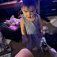 Katalayiah is registered to the contest to win money with this photo: child, girl, dress, indoor, room, toys, stuffed_animal, shoes, carpet, book, furniture, cabinet, television, blur, motion_blur, messy, floor, pigtails, clothing, portrait