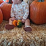 Katalayiah is registered to the contest to win money with this photo: baby, pumpkin, hay, fall, autumn, child, sitting, orange, clothing, headband, shoes, cute, harvest, seasonal, nature, outdoor, decor, person, small_pumpkin, gourd