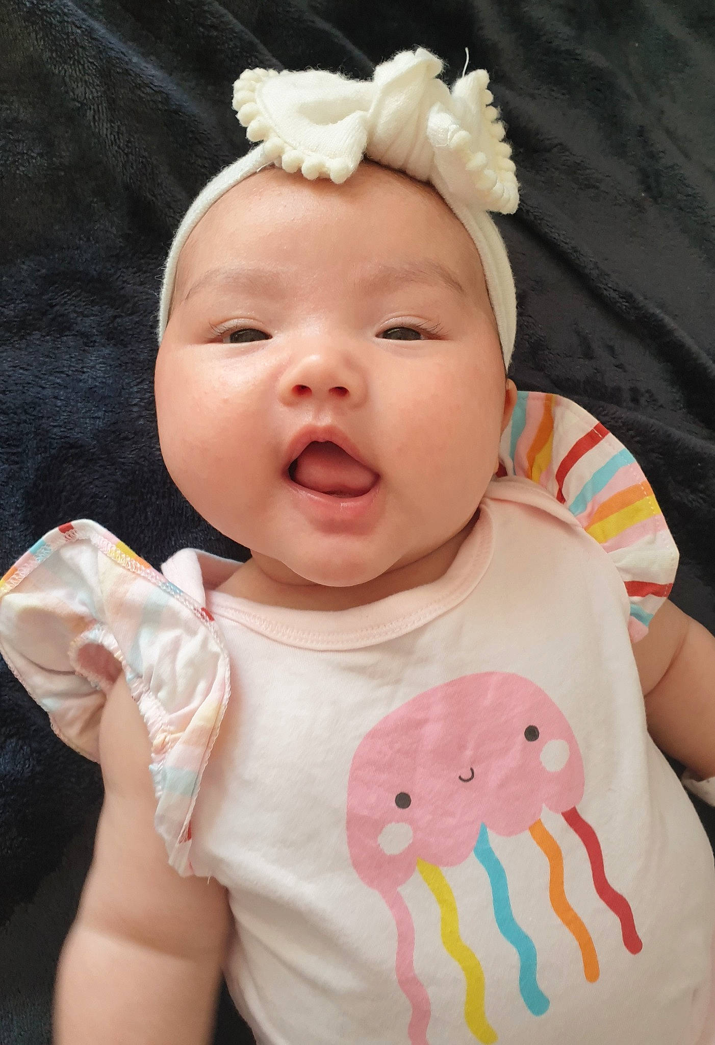 Jamie joined the competition — help win amazing prizes! baby, baby_toddler_clothing, cheek, dress, eye, eyelash, flash_photography, gesture, happy, headwear, human_body, lip, neck, nose, person, pink, skin, sleeve, smile, textile