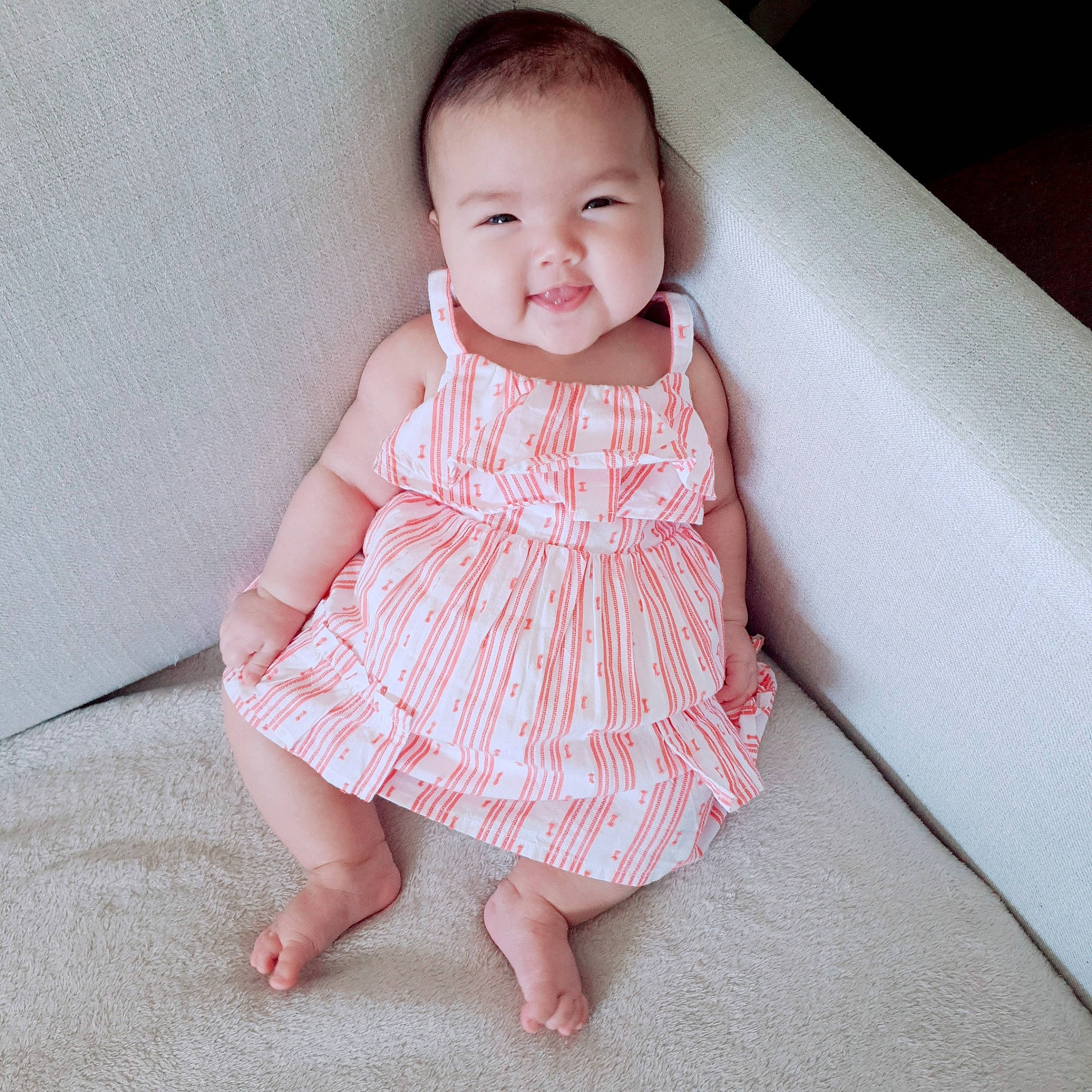 Jamie is registered to the contest to win money with this photo: baby, baby_toddler_clothing, child, clothing, collar, comfort, day_dress, dress, face, flooring, iris, one_piece_garment, pattern, person, pink, skin, sleeve, smile, textile, toddler