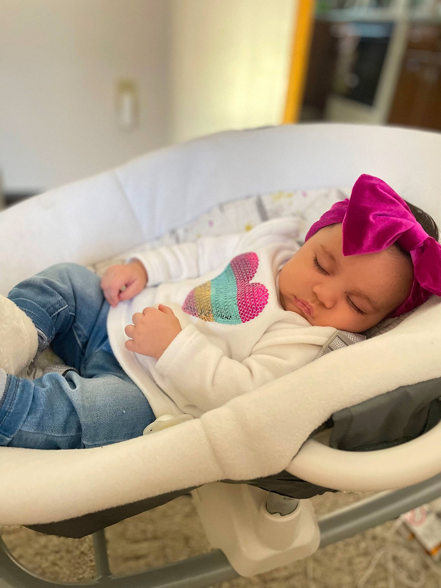 Rosalynn is registered to the contest to win money with this photo: baby, baby_products, baby_sleeping, baby_toddler_clothing, child, comfort, couch, foot, hat, headwear, human_leg, knee, leisure, linens, nap, person, room, sitting, sleep, sock