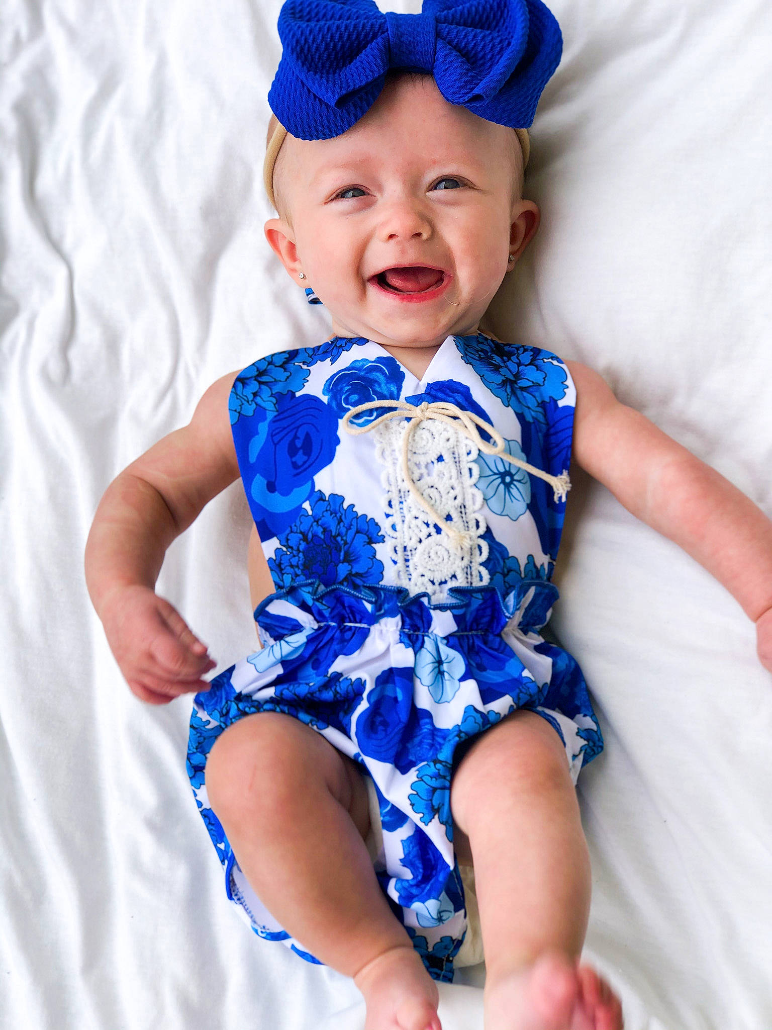 Emersyn is registered to the contest to win money with this photo: baby, baby_bloomers, baby_products, baby_toddler_clothing, blue, child, child_model, clothing, cobalt_blue, costume_accessory, design, electric_blue, fashion_accessory, hair_accessory, headband, headgear, headwear, pattern, person, product