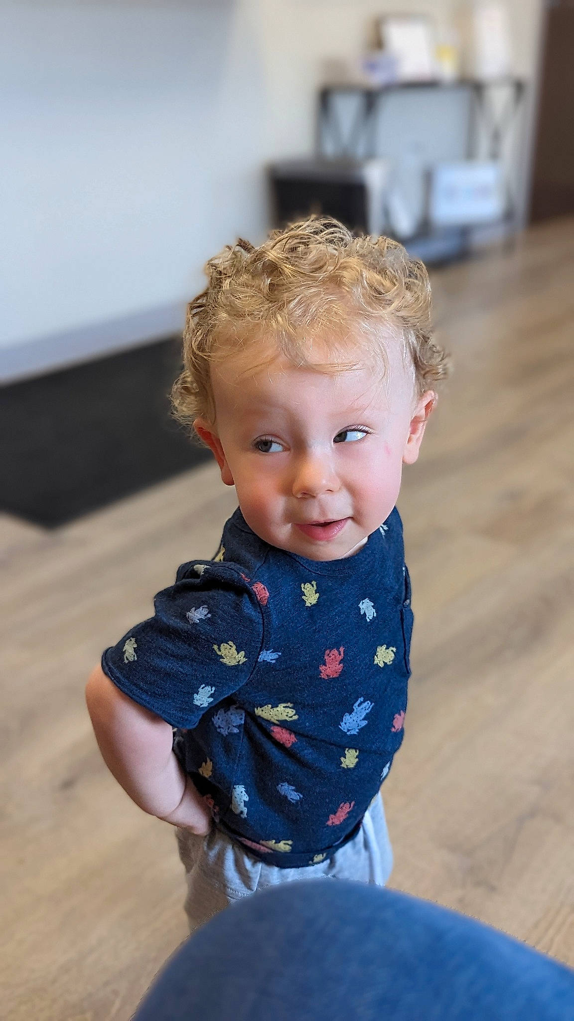 Lee is registered to the contest to win money with this photo: baby, baby_toddler_clothing, blond, child, electric_blue, flooring, hairstyle, happy, human_body, iris, leisure, neck, pattern, person, shoulder, skin, sleeve, smile, t_shirt, toddler