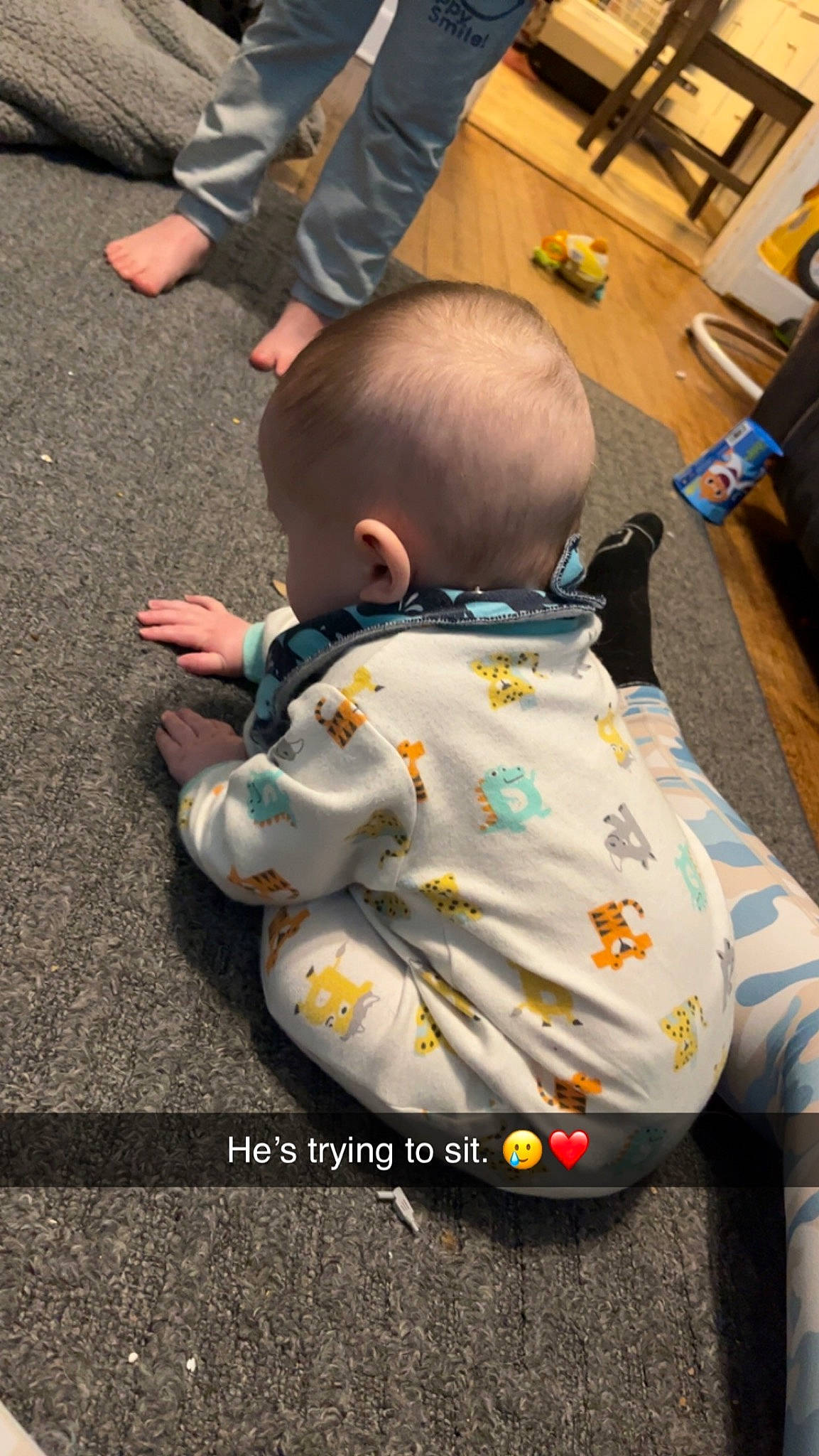 Callan joined the competition — help win amazing prizes! baby, baby_carriage, baby_products, baby_safety, baby_toddler_clothing, chair, child, comfort, flooring, foot, fun, human_leg, leisure, orange, person, play, sitting, thigh, toddler, toy