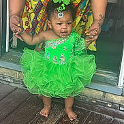 Aari'Onna is registered to the contest to win money with this photo: accessories, adult, baby, bride, clothing, costume, door, dress, face, female, footwear, head, jewelry, person, photography, portrait, sandal, skirt, wedding, woman