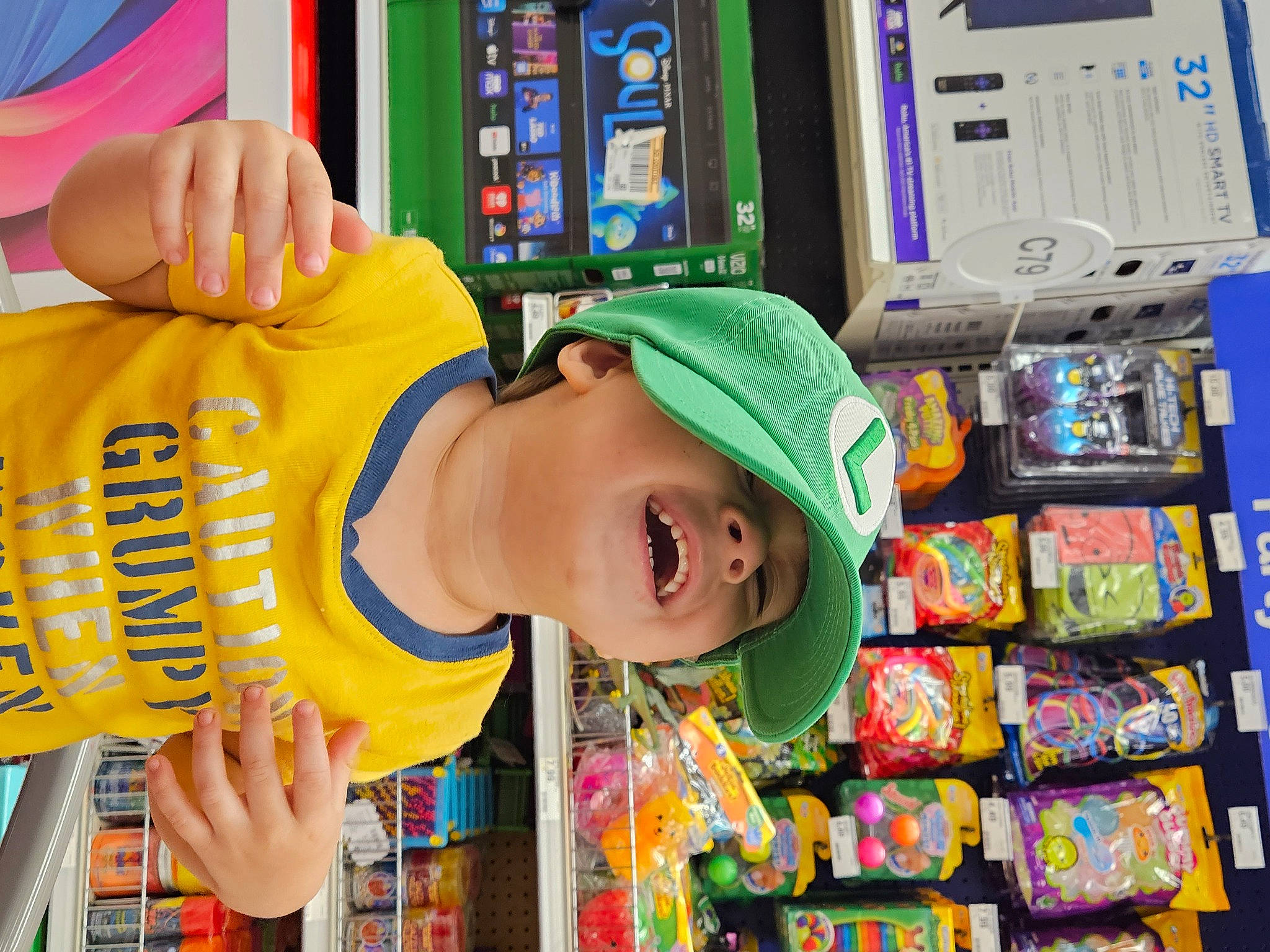 Jason joined the competition — help win amazing prizes! baseball_cap, cap, child, convenience_store, customer, fun, grocery_store, happy, hat, headwear, leisure, machine, person, play, recreation, retail, room, shelf, smile, snapshot