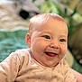 Imogen is registered to the contest to win money with this photo: baby, infant, smile, happy, face, child, onesie, pink_clothing, indoor, portrait, cute, soft_focus, young_child, baby_girl, cheerful, warm_lighting, closeup, eyes, skin, adorable