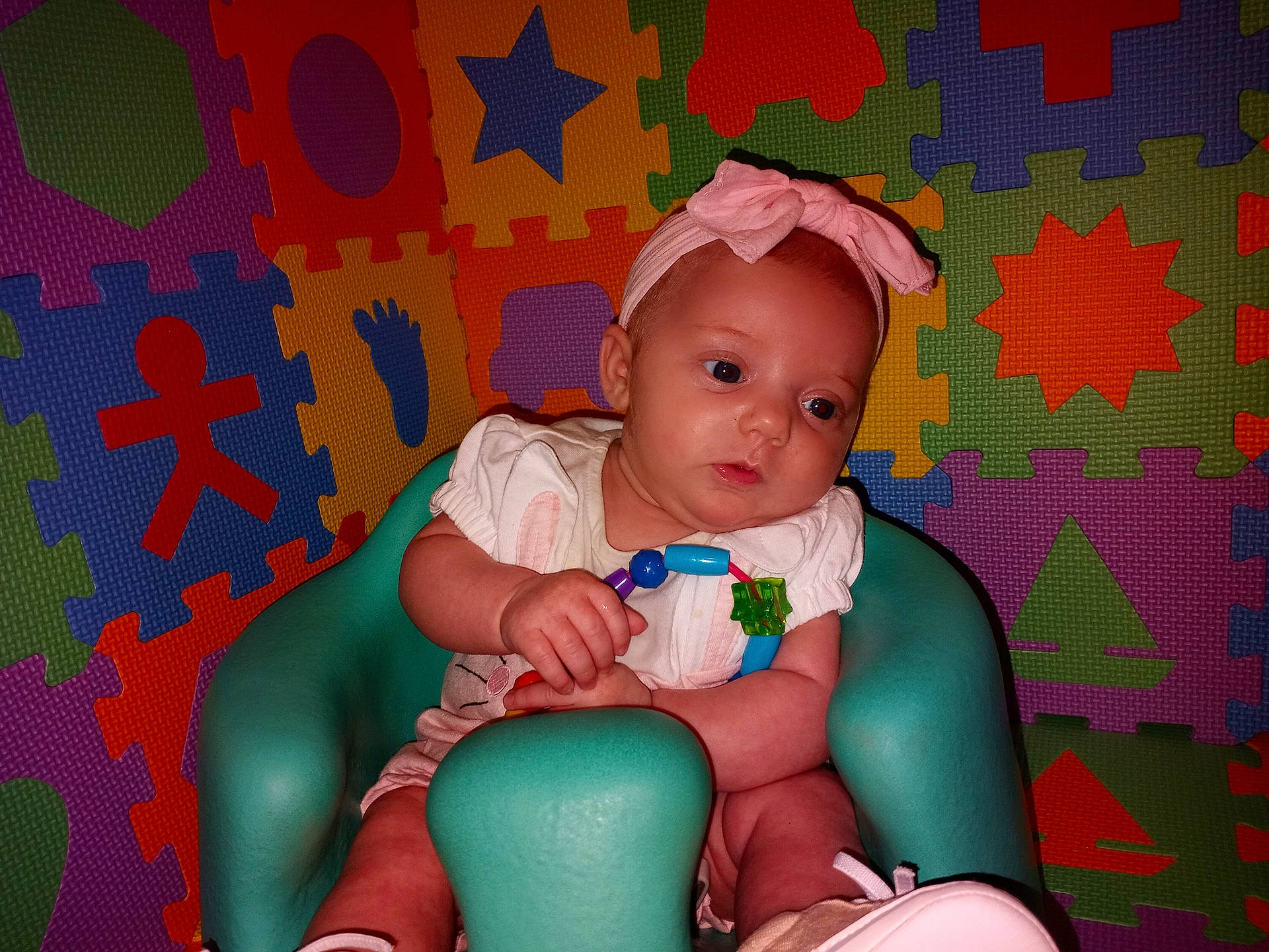 Arianna is registered to the contest to win money with this photo: baby, baby_toddler_clothing, cheek, child, comfort, flash_photography, fun, happy, head, knee, lap, magenta, nail, orange, pattern, person, pink, purple, thigh, toddler