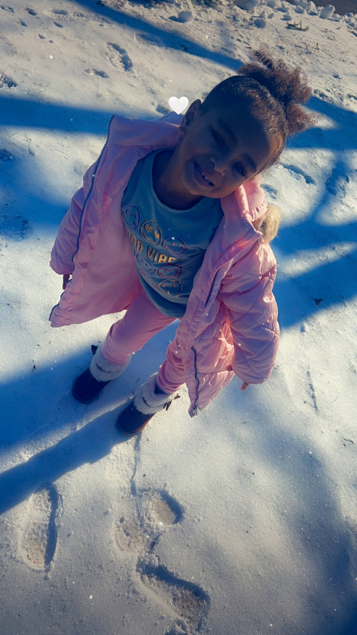 Ahlani is registered to the contest to win money with this photo: cloud, electric_blue, freezing, fun, happy, ice_cap, jacket, joy, landscape, leisure, people_in_nature, person, play, recreation, shadow, sitting, sky, snow, tints_and_shades, toddler