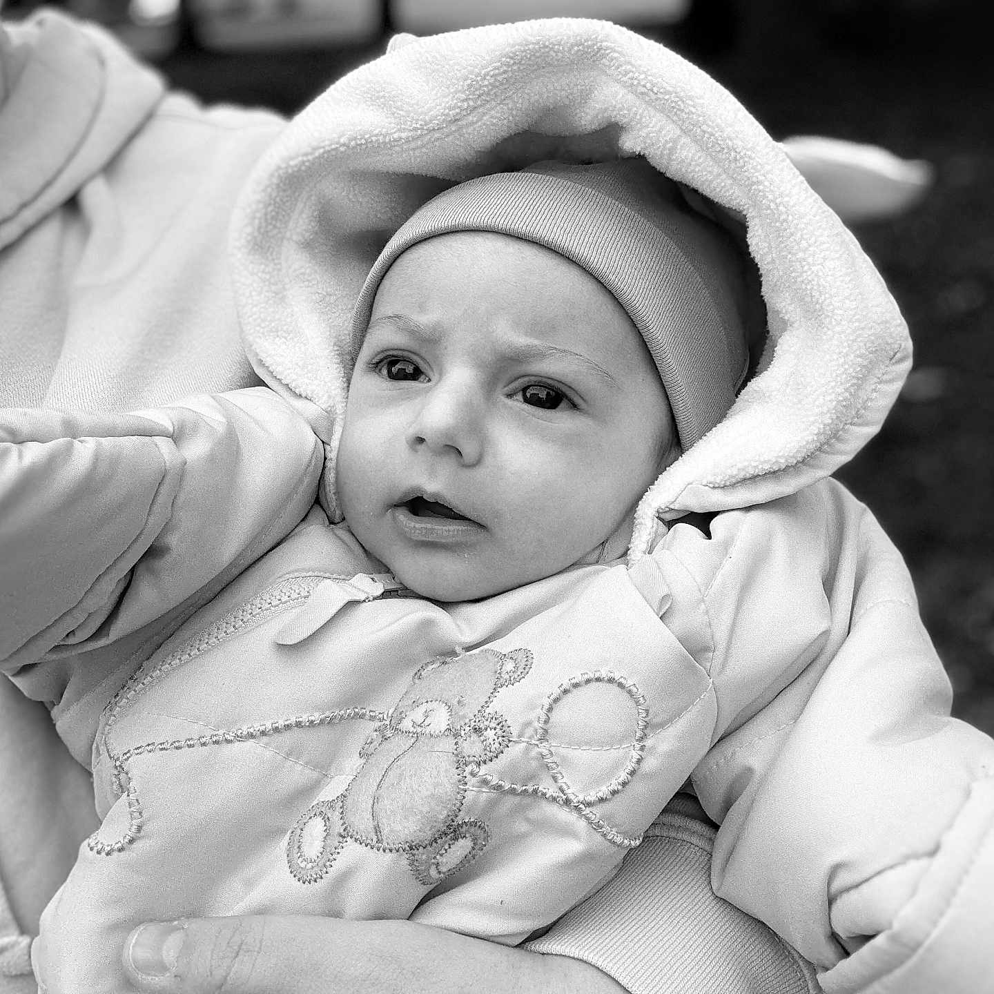 Enzo Rafael participe au concours pour gagner de l'argent avec cette photo : baby, black_and_white, child, closeup, cute, expression, face, hand, holding, hood, hoodie, infant, jacket, newborn, outdoor, person, portrait, teddy_bear, warm_clothing, winter