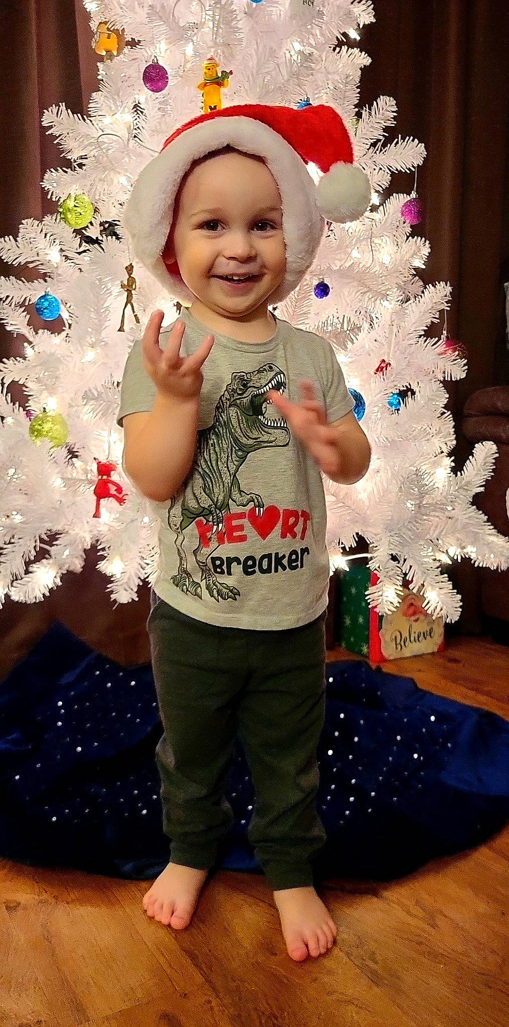 Briar joined the competition — help win amazing prizes! baby_toddler_clothing, blue, christmas, christmas_decoration, christmas_ornament, christmas_tree, face, fun, happy, headwear, holiday, holiday_ornament, human_body, joy, leg, ornament, person, sleeve, smile, standing
