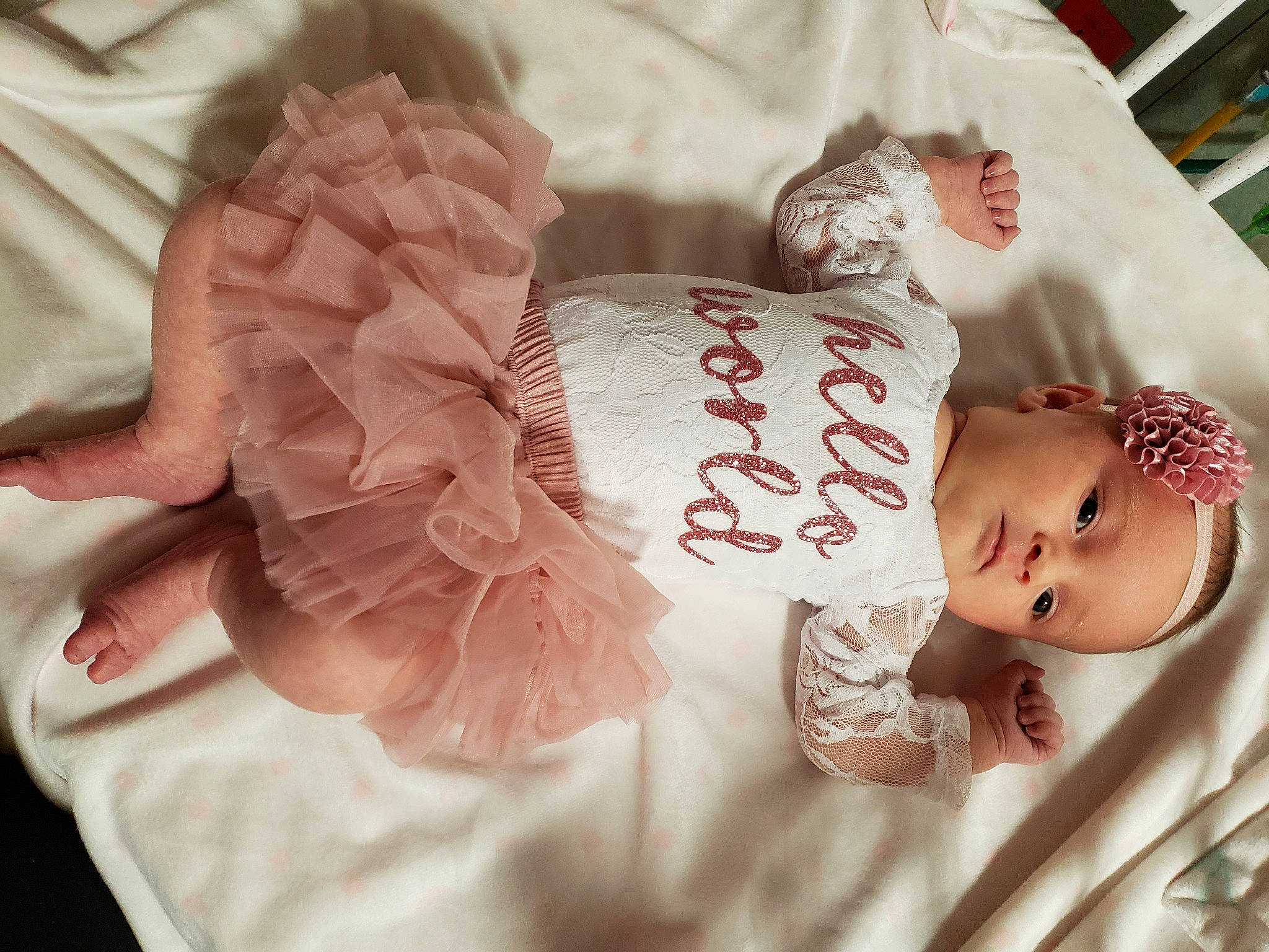 Gracelyn joined the competition — help win amazing prizes! baby, baby_products, baby_sleeping, baby_toddler_clothing, child, dress, hair_accessory, hand, headpiece, peach, person, pink, product, textile, toddler