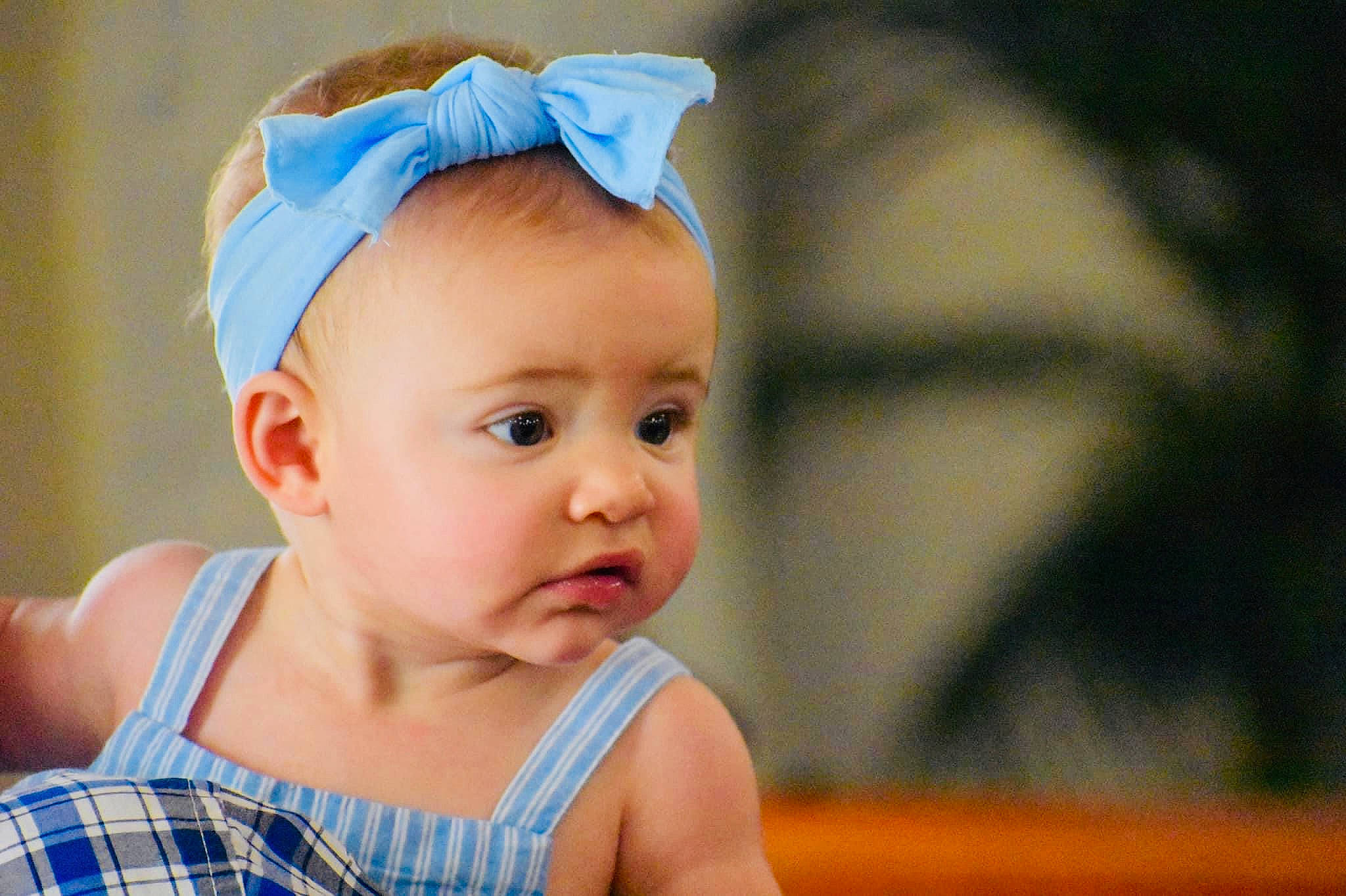 Gracelyn is registered to the contest to win money with this photo: baby, baby_toddler_clothing, blue, chin, clothing, eye, eyebrow, eyelash, fun, grass, happy, head, headband, headgear, headpiece, iris, lip, person, skin, smile