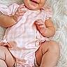 Rylee joined the competition — help win amazing prizes! baby, infant, smile, pink_headband, pink_outfit, checkered_pattern, fluffy_rug, cute, happy, child, skin, legs, hands, portrait, indoors, soft_texture, headwear, one_person, sitting, baby_clothes