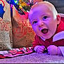 Colter is registered to the contest to win money with this photo: baby, carpet, celebration, cheerful, child, christmas, crawling, cute, face, festive, gift_bags, happy, holiday, indoors, infant, portrait, red_clothing, seasonal, smiling, toddler