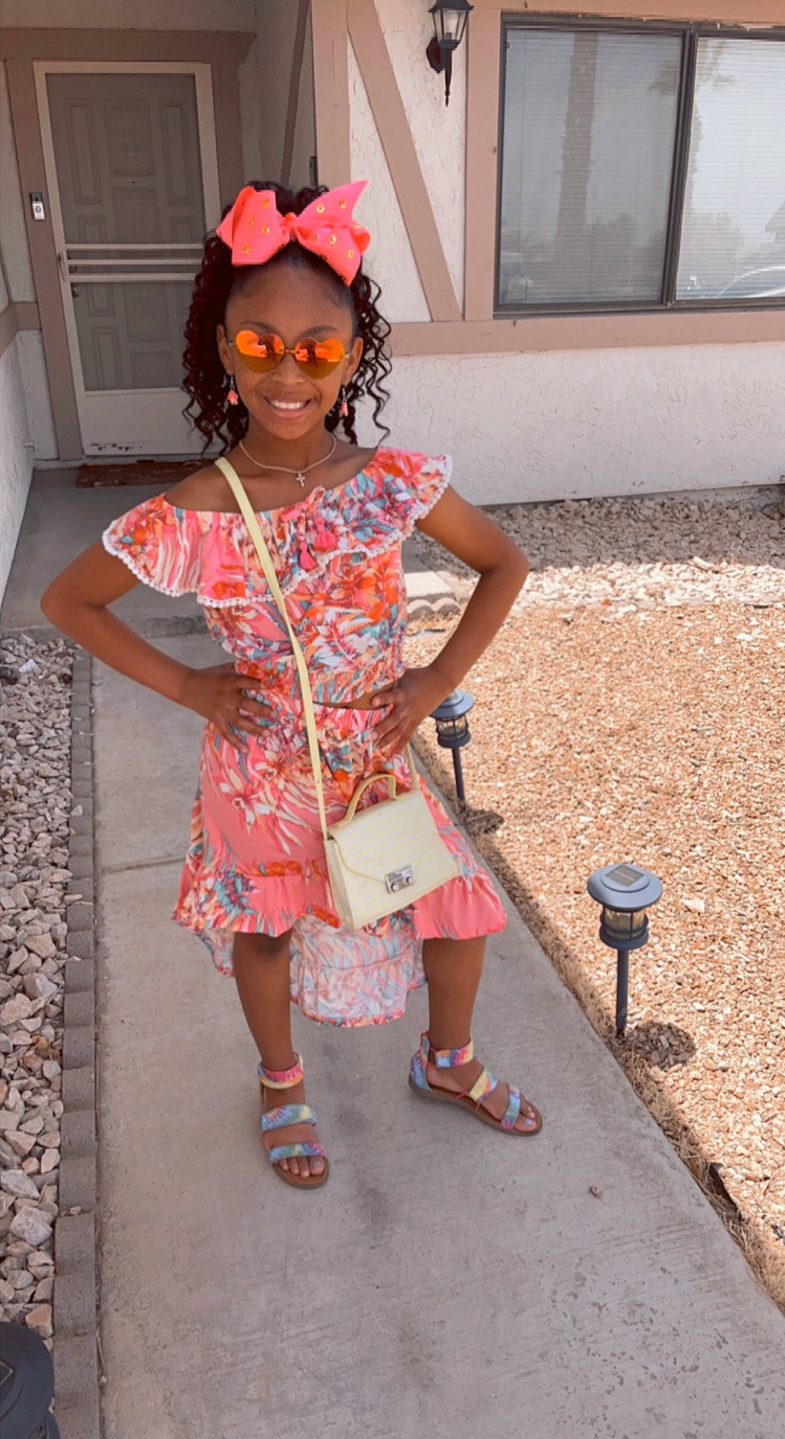 Laila is registered to the contest to win money with this photo: child, clothing, eyewear, fashion_design, fun, hairstyle, headgear, human_leg, joy, leg, magenta, people, person, pink, sandal, shoe, sidewalk, sleeve, smile, sneakers