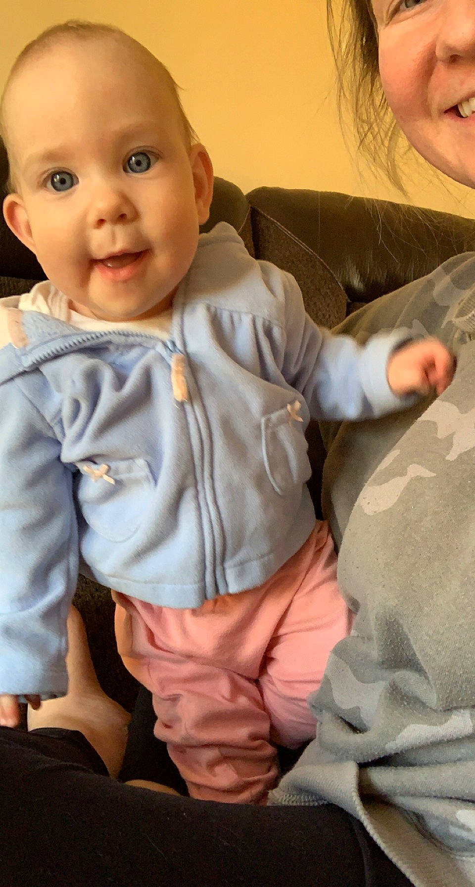 Adyson is registered to the contest to win money with this photo: baby_toddler_clothing, cheek, comfort, eye, face, gesture, happy, iris, joint, lip, mouth, neck, nose, outerwear, person, shoulder, skin, sleeve, smile, textile